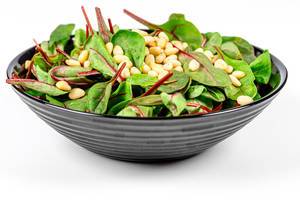 Fresh salad with spinach and pine nuts. Dietary food (Flip 2020)