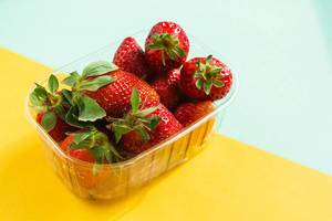 Fresh strawberries on colorful background