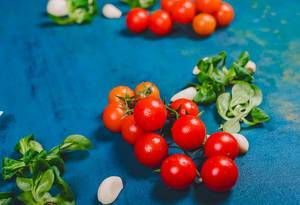 Fresh Tomatoes on Blue Background (Flip 2019)