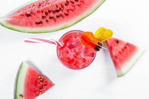 Fresh watermelon smoothie in the glass on wooden white background. Summer, healthy organic food concept. (Flip 2019)