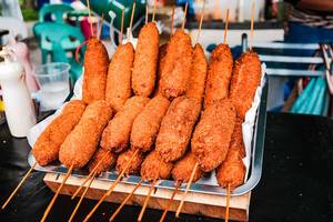 Fried corn dogs on display at a food fair in Bacolod