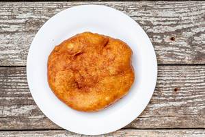 Fried meat pie on a white plate