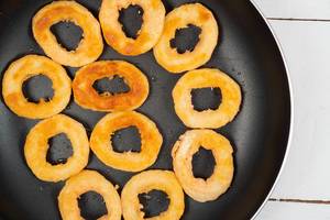 Fried Onion Rings in the frying pan (Flip 2020)