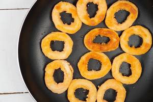 Fried Onion Rings in the frying pan