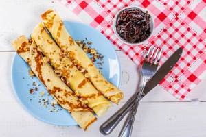 Fried pancakes with jam and nuts