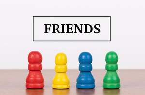 Friends concept with pawn figurines on table