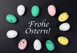 Frohe Ostern text with painted Easter eggs