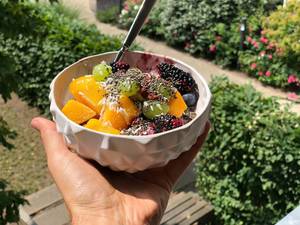 Fruit salad with mango, grapes, blackberries, blueberries and chia seeds