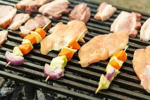 Frying Vegetables and Chicken Meat on barbecue grill
