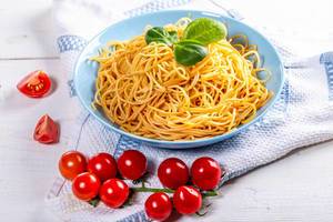 Full plate of delicious spaghetti with tomatoes (Flip 2019)