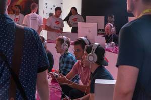 Games fair visitors at Stadia Area at Gamescom, with cloud-native platform, lets you play across devices