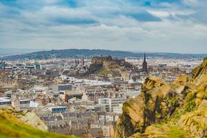 General view of Edinburgh from Edinburgh Castle with Holyrood Park and Arthur`s Seat. Editorial Stock Photo