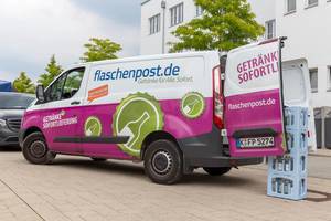German pun on a delivery white-pink van of a beverage supplier in the city