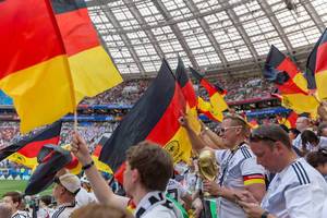 German soccer fans with flags and trophies