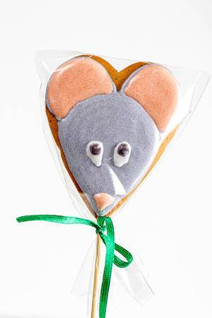 Gingerbread mouse figure on a wooden stick