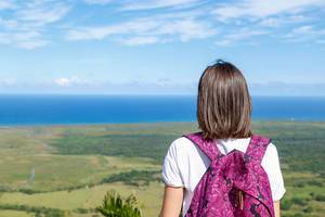 Girl with backpak looks to the ocean from Redonda mountine at Dominican Republic  Flip 2019