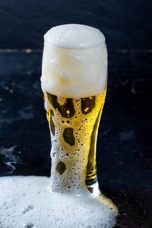 Glass of beer with foam