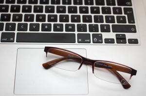 Glasses on a Laptop Close-Up
