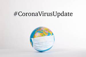 Globe with medical mask and #CoronaVirusUpdate text on white background.jpg