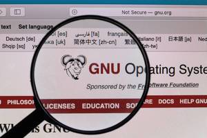 GNU Operating System logo under magnifying glass
