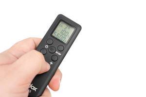 Godox-remote-controller-for-Led-reflectors-in-the-hand-with-copy-space.jpg