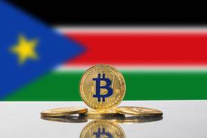 Golden Bitcoin and flag of South Sudan