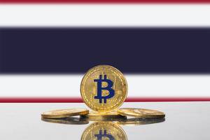Golden Bitcoin and flag of Thailand