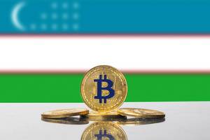 Golden Bitcoin and flag of Uzbekistan