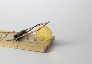 Golden Bitcoin caught in mouse trap
