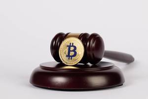 Golden Bitcoin with judge hammer