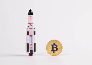 Golden Bitcoin with rocket ship
