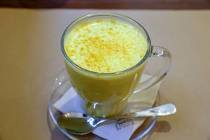 Golden Milk with turmeric, ginger and black peppers a soothing and healing drink and is served warm at "Petit Brot" in Barcelona, Spain