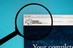 Grand National logo on a computer screen with a magnifying glass