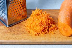 Grated carrots and grater