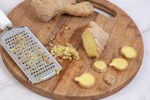 Grated Ginger on the wooden board
