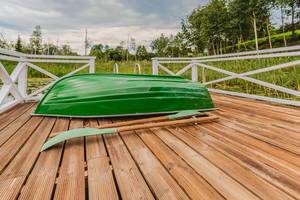 Green Boat On Wooden Footbridge