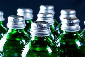 Green glass bottles with lids
