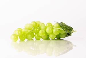 Green grape with leaves isolated on white background (Flip 2019)