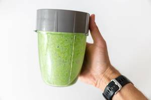 Green healthy protein drink made of spinach and almond powder