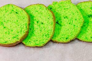 Green sliced sponge biscuit on parchment paper (Flip 2019)