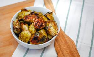 Grilled Brussel Sprout serve in a White Bowl