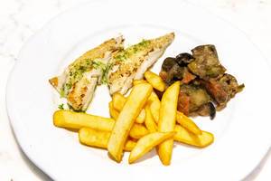 Grilled snapper fillet with fries and vegetables