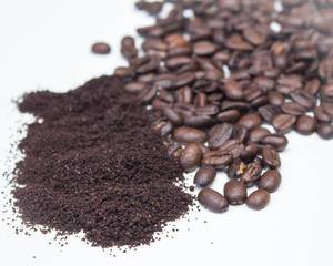 Ground Coffee and Bean on a White Background