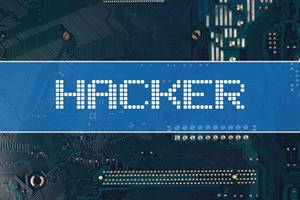 Hacker text over electronic circuit board background