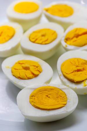Halves of boiled eggs on a white plate (Flip 2019)