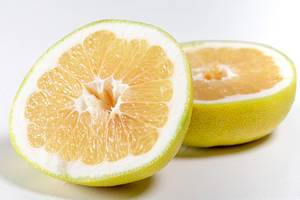 Halves of the Citrus Sweetie or Pomelit on white background (Flip 2019)