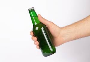 Hand holding beer bottle without label isolated on white background (Flip 2019)
