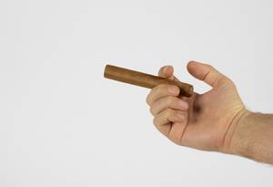 Hand holding cigar
