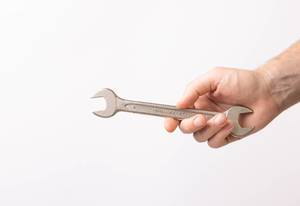 Hand holding handle wrench (Flip 2019)