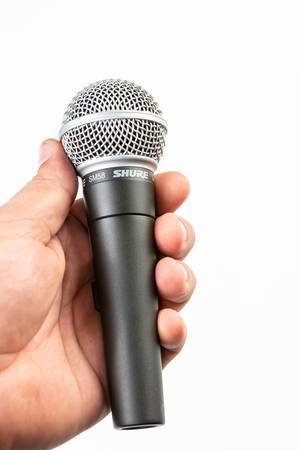 Hand holding Vocal Microphone